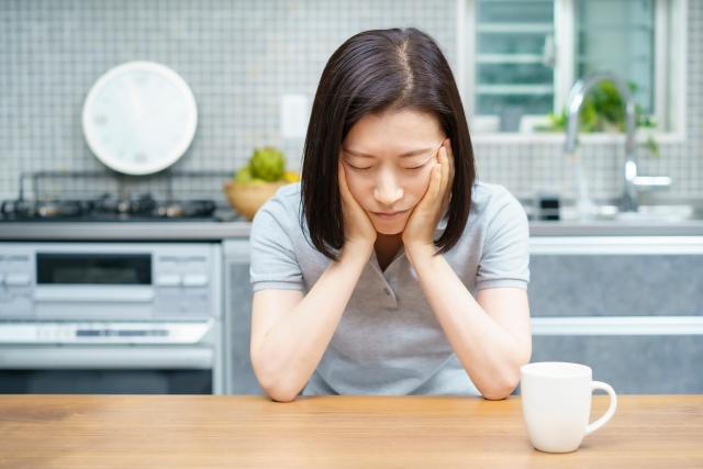 体調不良の女性